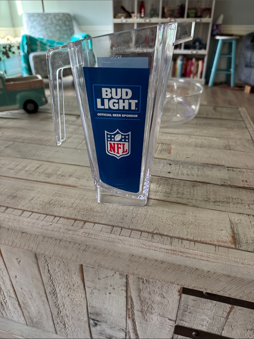 Budweiser Clear plastic Pitcher with Blue Bud Light NFL Panel.